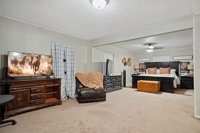 bedroom featuring ceiling fan, carpet flooring, and a textured ceiling