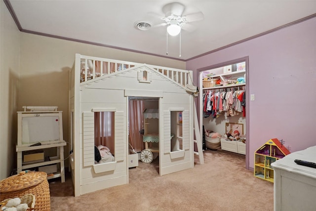 bedroom with carpet flooring, visible vents, ornamental molding, and a closet