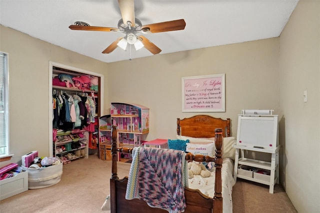 bedroom with carpet flooring, ceiling fan, and a closet