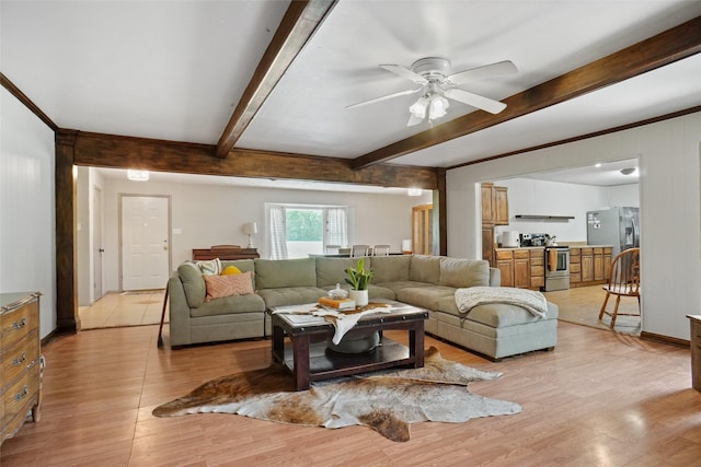 living room with a ceiling fan, beam ceiling, and light wood finished floors