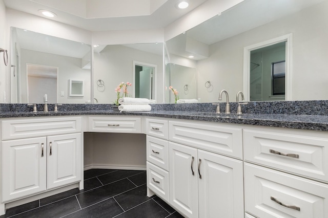 full bath with recessed lighting, a sink, tile patterned floors, and double vanity