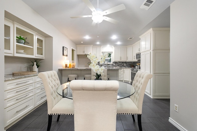dining area with visible vents, a ceiling fan, dark wood-type flooring, and recessed lighting