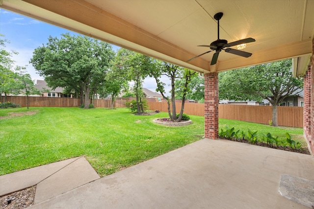 view of yard featuring ceiling fan, a fenced backyard, and a patio area