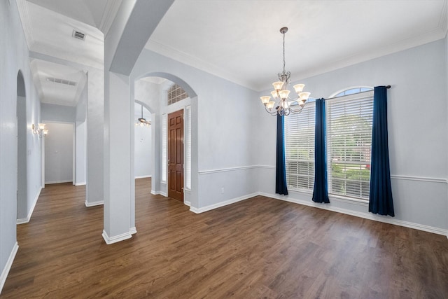 unfurnished dining area with arched walkways, visible vents, dark wood-type flooring, and a notable chandelier