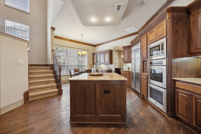 1041 Bandelier Dr, Allen, TX 75013 - kitchen with built in appliances, a center island, a chandelier, light stone countertops, and dark wood-style floors