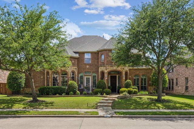 1041 Bandelier Dr, Allen, TX 75013 - view of front of property with brick siding, a front yard, and roof with shingles