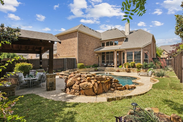 1041 Bandelier Dr, Allen, TX 75013 - back of property with brick siding, a patio area, a chimney, a sunroom, and roof with shingles