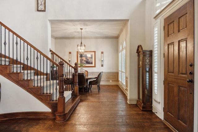 1041 Bandelier Dr, Allen, TX 75013 - entrance foyer featuring stairway, dark wood finished floors, a chandelier, and crown molding