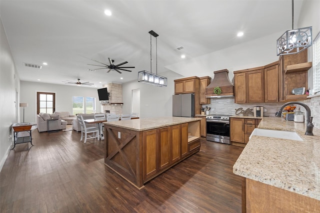 kitchen featuring visible vents, open shelves, custom exhaust hood, a sink, and stainless steel appliances