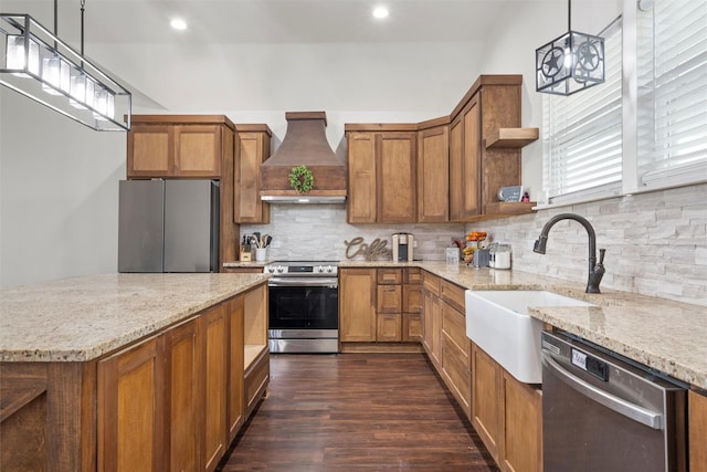kitchen with open shelves, premium range hood, brown cabinets, a sink, and appliances with stainless steel finishes