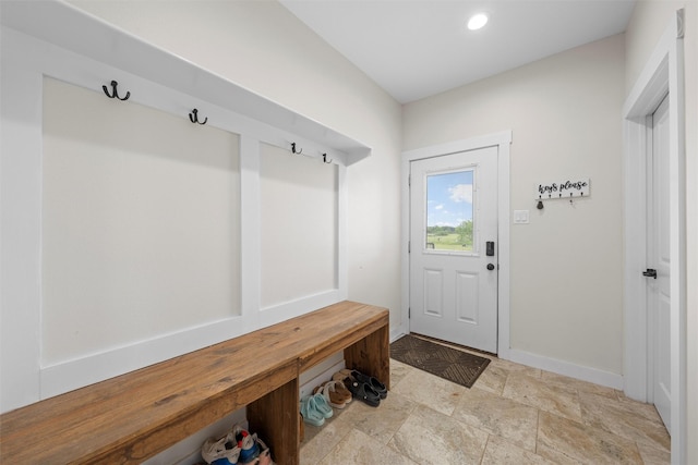 mudroom featuring stone finish floor, baseboards, and recessed lighting