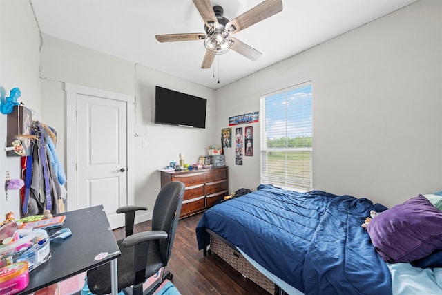 bedroom featuring a ceiling fan and wood finished floors