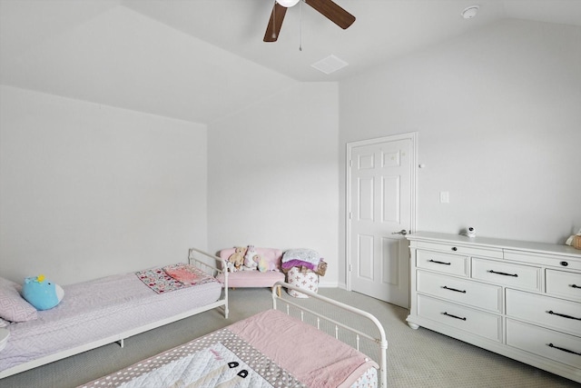bedroom with light colored carpet, a ceiling fan, vaulted ceiling, and visible vents