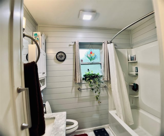 bathroom featuring toilet, wood walls, and shower / bathtub combination with curtain