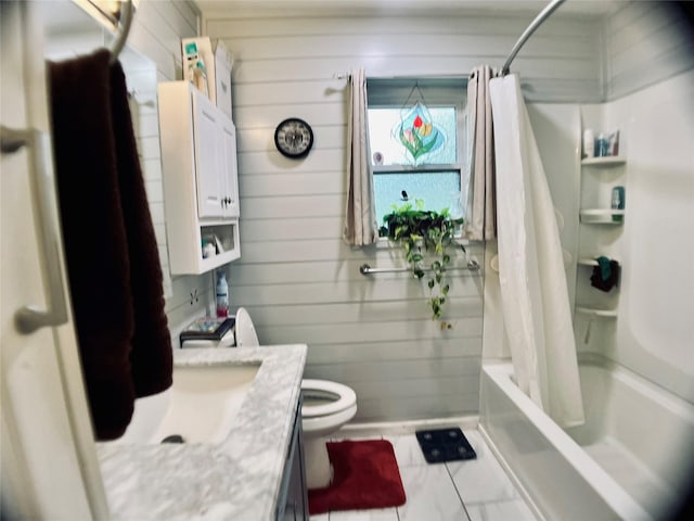 full bath featuring shower / bath combo, wooden walls, toilet, and vanity