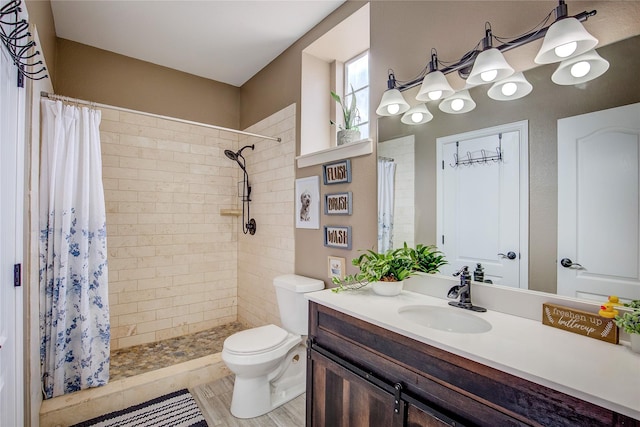 11041 Helms Trl, Forney, TX 75126 - bathroom featuring vanity, a tile shower, and toilet