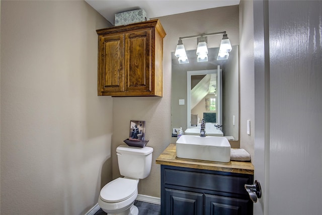 11041 Helms Trl, Forney, TX 75126 - half bathroom featuring vanity, baseboards, and toilet