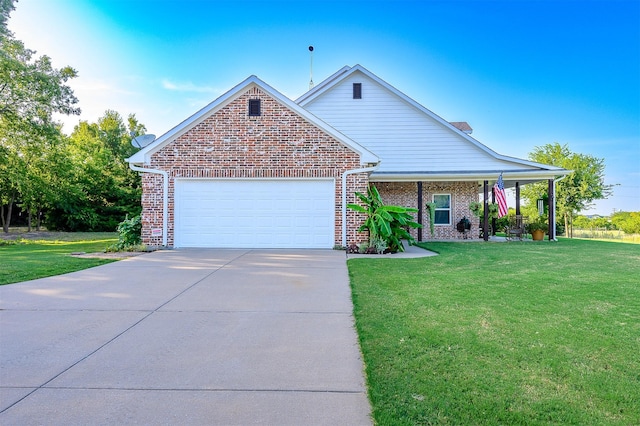 view of front of property with brick siding, a garage, driveway, and a front lawn