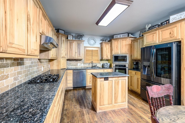 kitchen featuring a center island, dark wood-style flooring, extractor fan, and stainless steel appliances