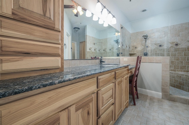 bathroom featuring vanity and a walk in shower