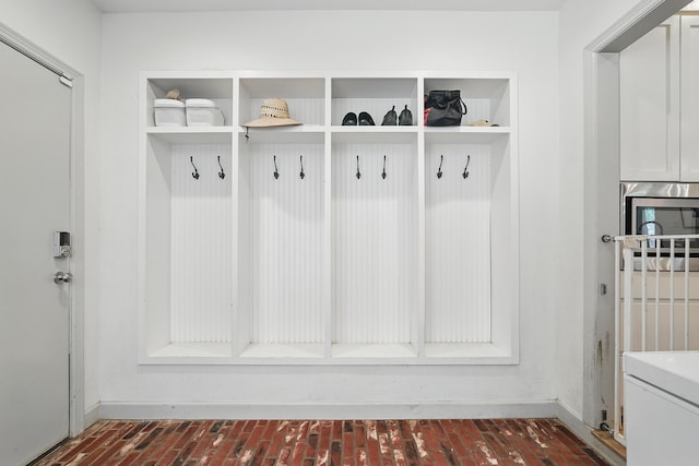 1202 Grand Ave, Abilene, TX 79605 - mudroom featuring baseboards and brick flooring