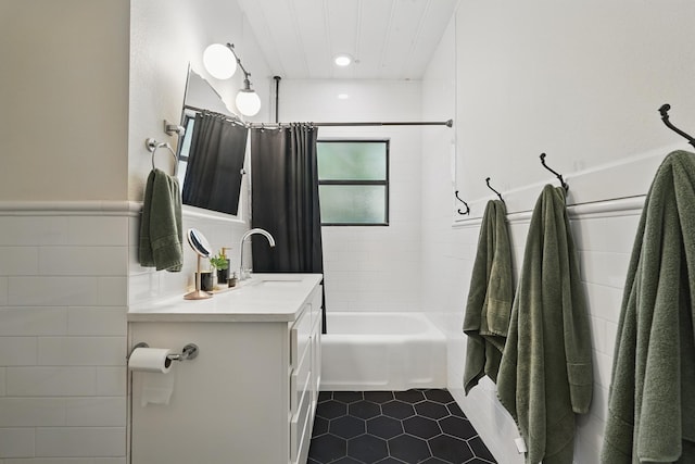 1202 Grand Ave, Abilene, TX 79605 - bathroom with vanity, tile walls, tile patterned flooring, shower / bathtub combination with curtain, and a wainscoted wall