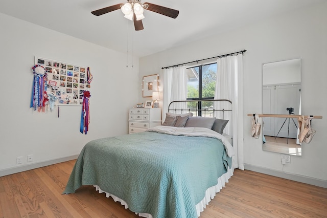 1202 Grand Ave, Abilene, TX 79605 - bedroom featuring wood finished floors, baseboards, and ceiling fan