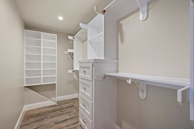 walk in closet featuring wood finished floors
