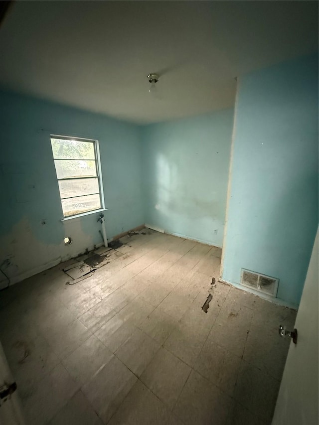spare room featuring visible vents