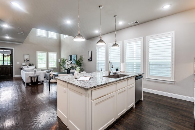 kitchen featuring baseboards, a sink, dark wood-style flooring, and visible vents