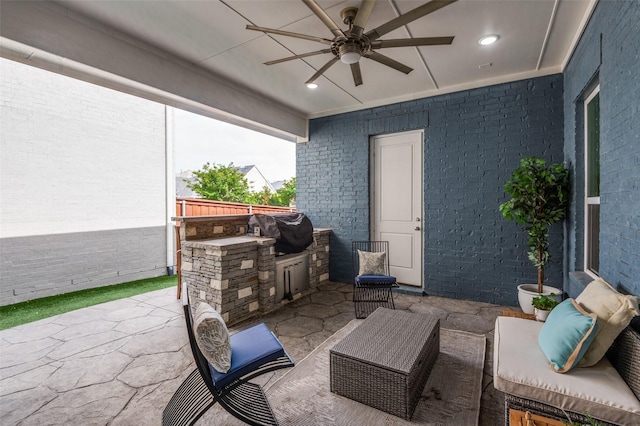 view of patio / terrace with ceiling fan, outdoor lounge area, exterior kitchen, and area for grilling