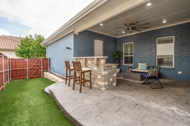view of patio / terrace featuring a fenced backyard and a ceiling fan