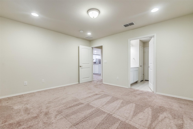 7793 Gulf Walk Rd, Frisco, TX 75036 - unfurnished bedroom featuring light carpet, baseboards, recessed lighting, and connected bathroom