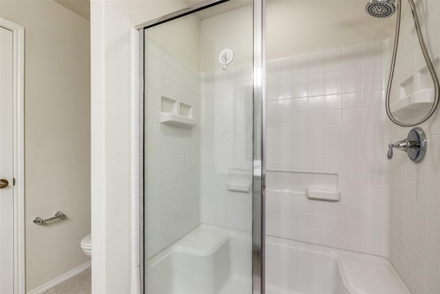 7793 Gulf Walk Rd, Frisco, TX 75036 - bathroom with a stall shower, toilet, and baseboards