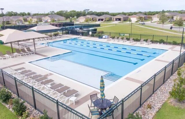 7793 Gulf Walk Rd, Frisco, TX 75036 - community pool with fence, a residential view, and a patio area