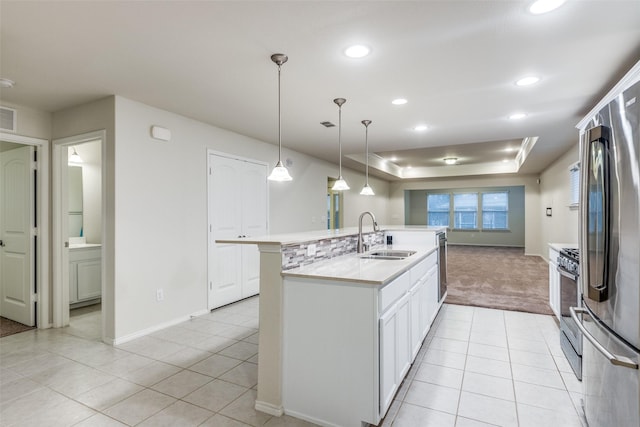 7793 Gulf Walk Rd, Frisco, TX 75036 - kitchen with a sink, appliances with stainless steel finishes, light tile patterned flooring, light carpet, and baseboards