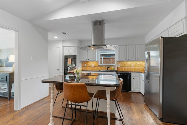 kitchen featuring white cabinetry, island exhaust hood, and black appliances
