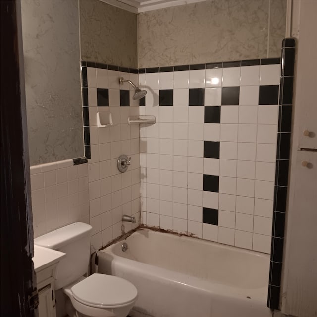 full bathroom with toilet, tile walls, shower / tub combination, and vanity