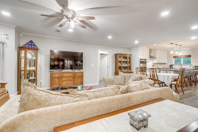 3707 Knob Hill Rd, Azle, TX 76020 - living area with a ceiling fan, recessed lighting, light wood-type flooring, crown molding, and baseboards