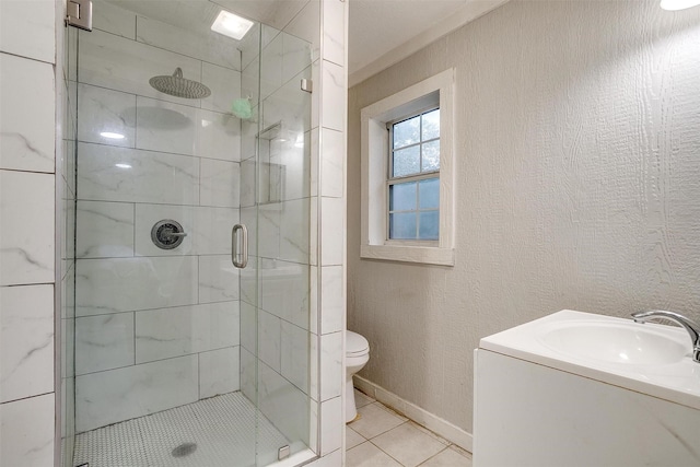 full bath with tile patterned flooring, vanity, toilet, baseboards, and a shower stall