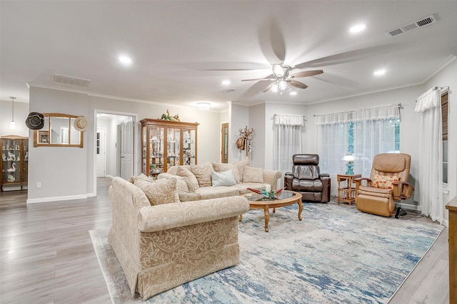living room with visible vents, ornamental molding, wood finished floors, ceiling fan, and recessed lighting