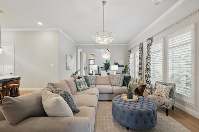 living room featuring crown molding, baseboards, a chandelier, recessed lighting, and light wood-style flooring