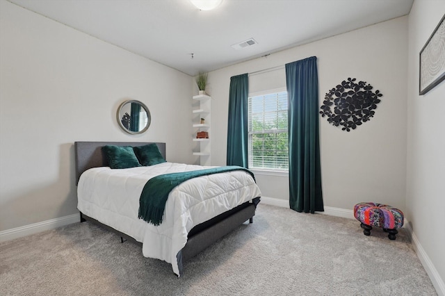 bedroom featuring baseboards, carpet, and visible vents