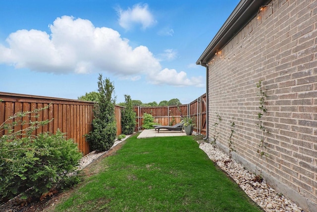 view of yard with a fenced backyard and a patio area