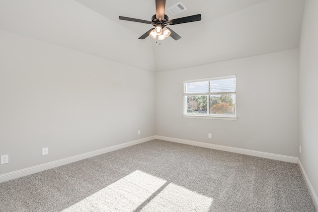 unfurnished room featuring ceiling fan, carpet, baseboards, lofted ceiling, and visible vents