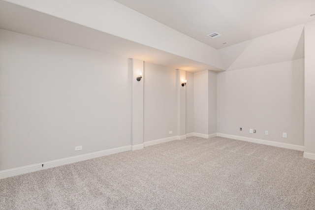 below grade area with baseboards, carpet flooring, and visible vents