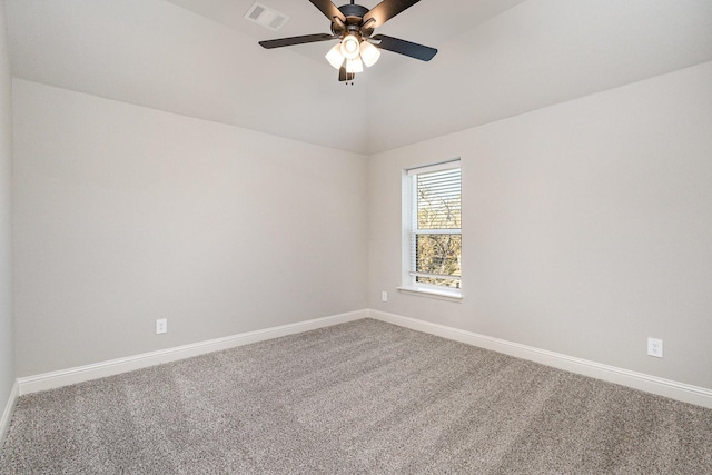 carpeted empty room featuring baseboards, a ceiling fan, and visible vents