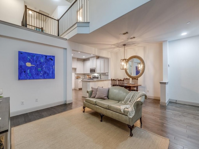 6285 Davison Way, Mckinney, TX 75070 - living room with baseboards, visible vents, a chandelier, and dark wood-type flooring