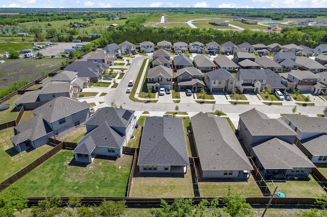 birds eye view of property with a residential view