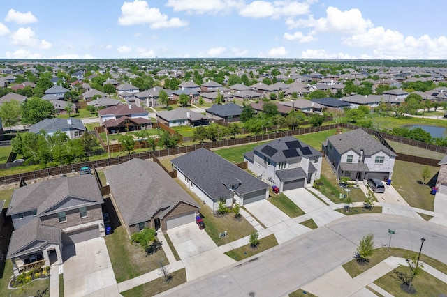 birds eye view of property with a residential view